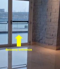 Balcony entrance with yellow arrow