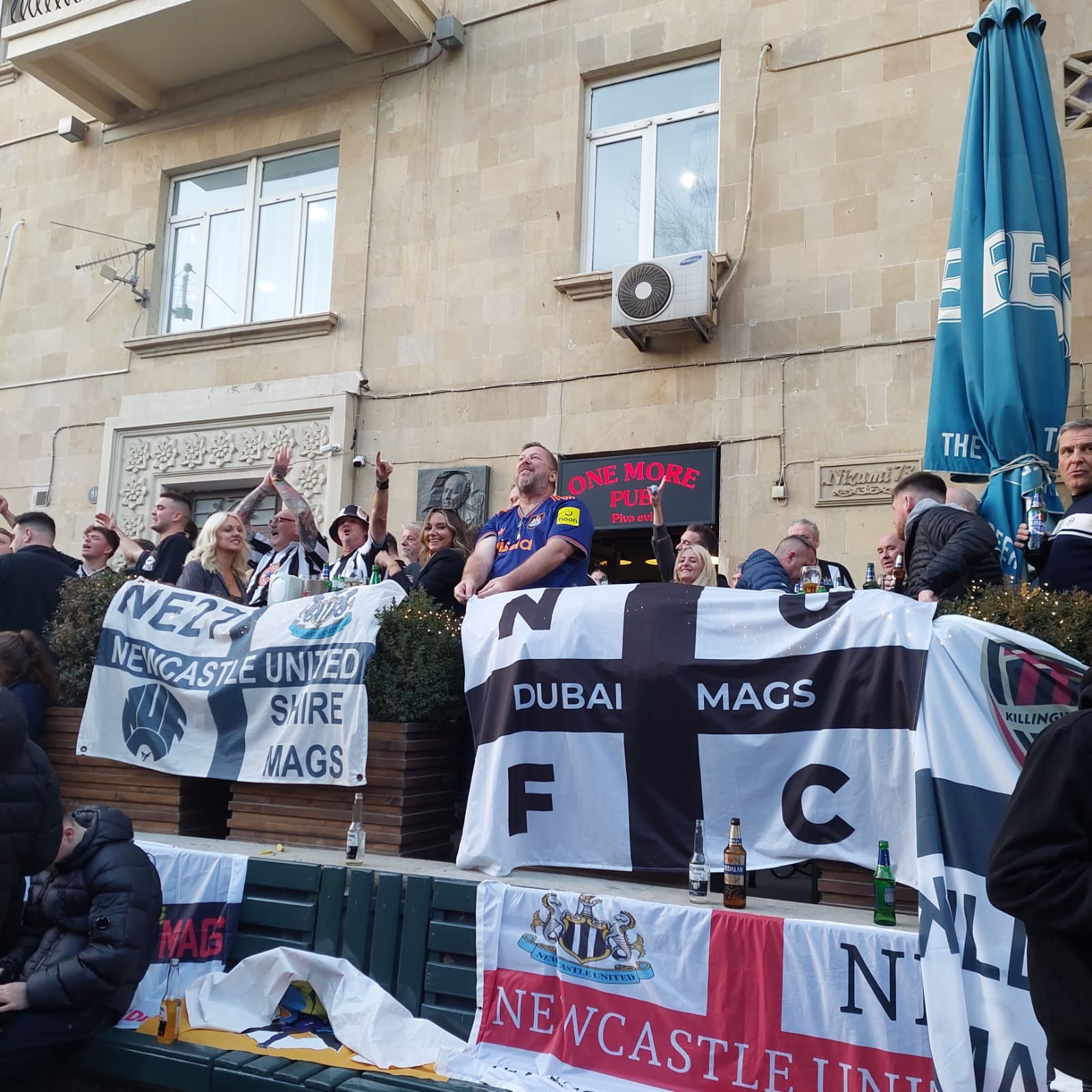 Dubai Mags fans with banners at Baku away end